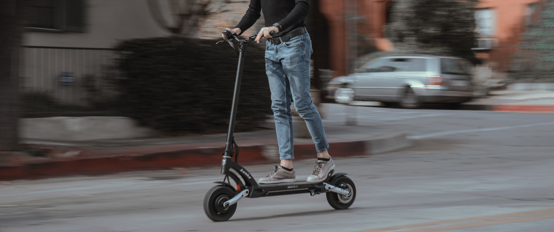 Man riding Kaabo USA Mantis 10 Lite Dual Motor Scooter