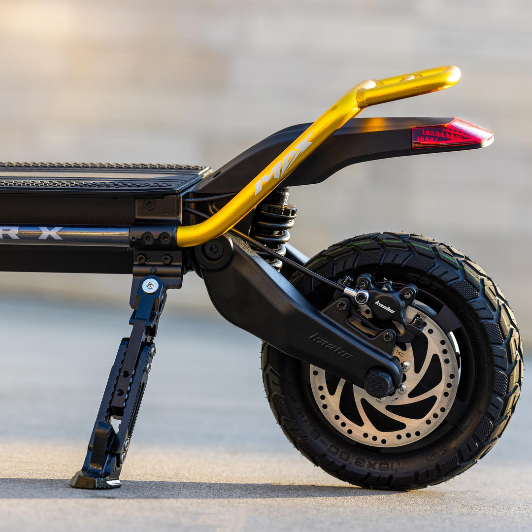 Kaabo Wolf Warrior X Max electric scooter rear wheel with disc brake, rear suspension, tire tread, and rear fender