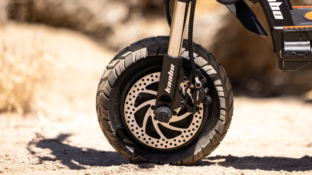 Kaabo Wolf Warrior 11 MAX front suspension system on off-road terrain
