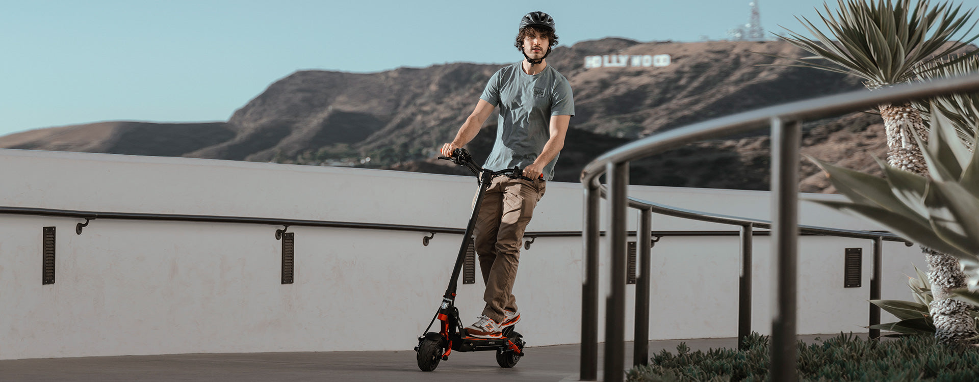 Man riding Kaabo Mantis 8 dual-motor electric scooter