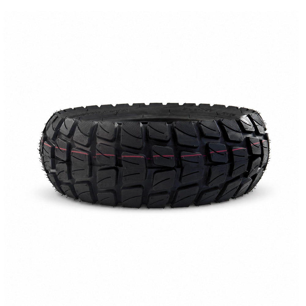 Close-up of the deep off-road tread on a Kaabo 10-inch electric scooter tire.