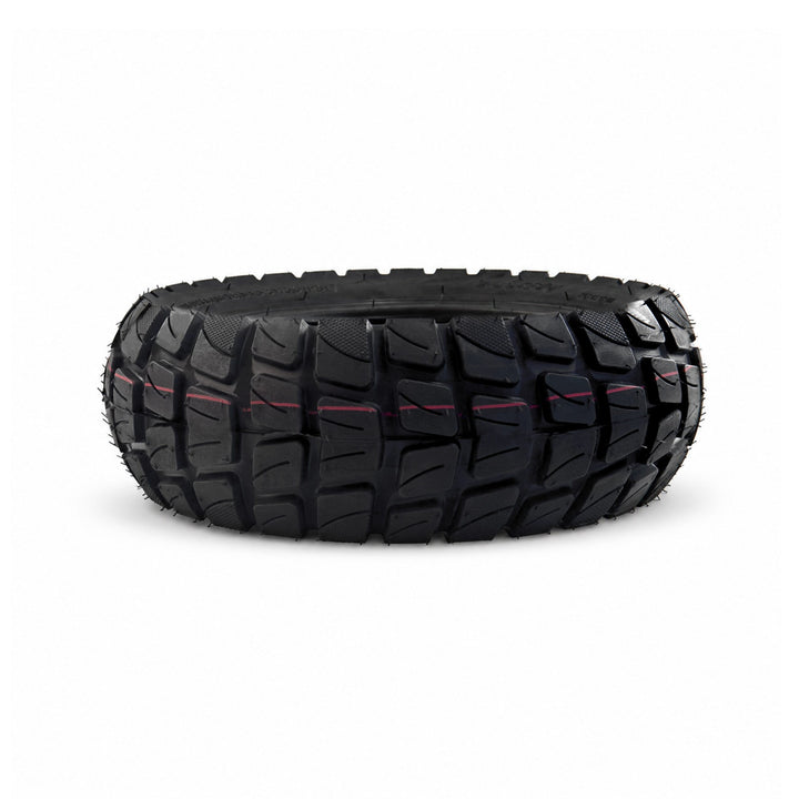 Close-up of the deep off-road tread on a Kaabo 10-inch electric scooter tire.