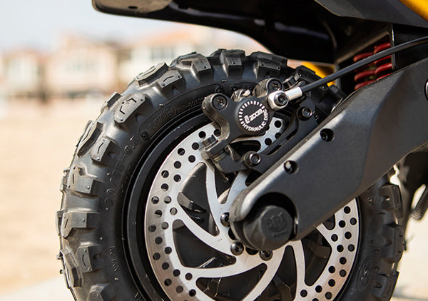 Close-up of the hydraulic oil brake system on the Kaabo Wolf King GT Pro scooter
