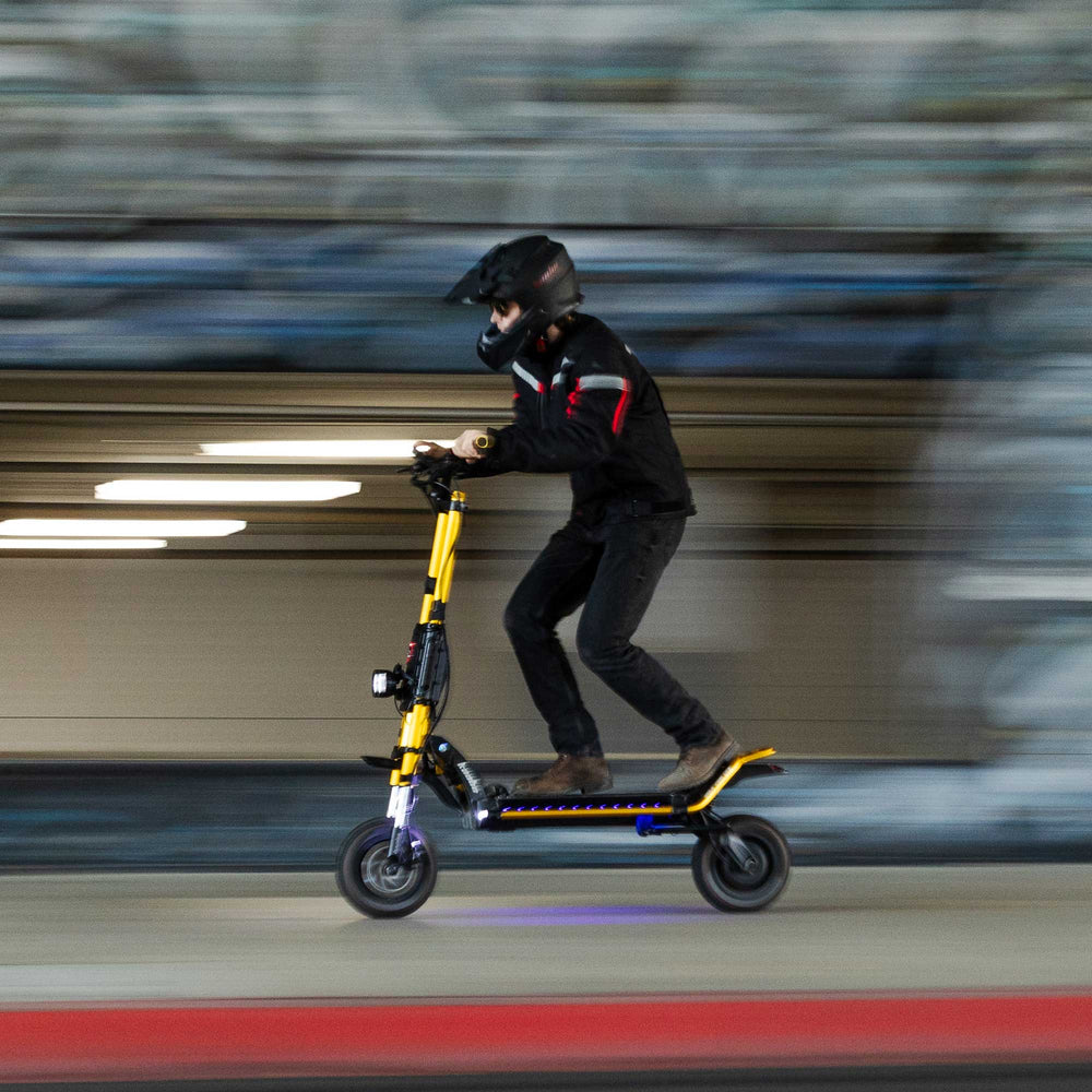 Kaabo King GTR high performance electric scooter riding at speed in an urban environment for adult riders