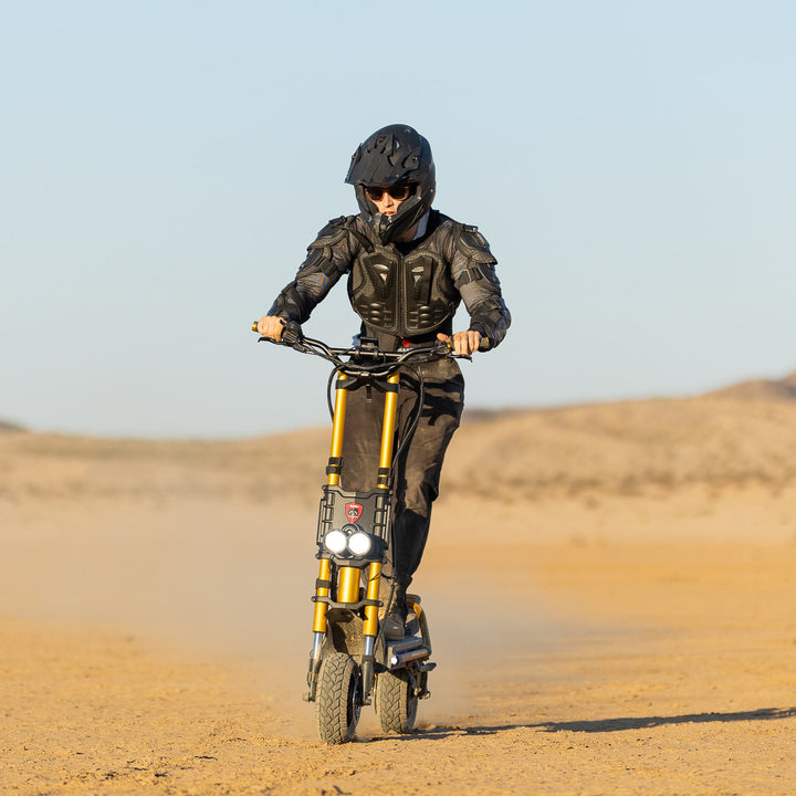 Kaabo King GTR off-road electric scooter riding on desert terrain, powerful electric scooter for adult riders