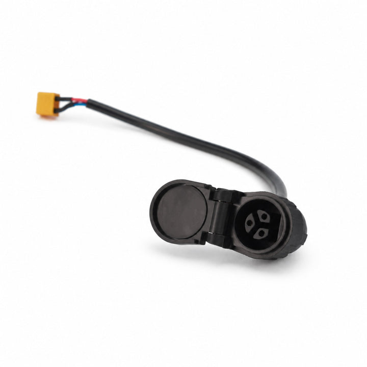 Close-up of the 3-pin waterproof charging port with an open protective cover for Kaabo Mantis X Plus and Mantis King GT electric scooters.