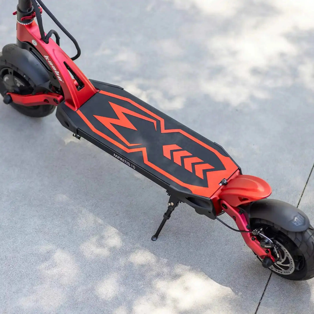 Red and black kaabo mantis 10 electric scooter on a concrete surface
