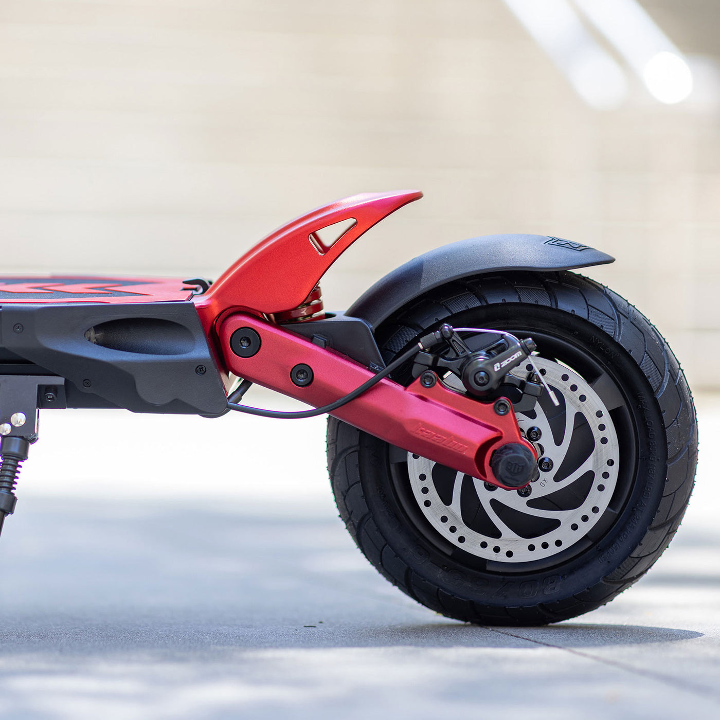 Detailed view of Kaabo USA Mantis 10 Lite electric scooter's rear wheel and suspension mechanism